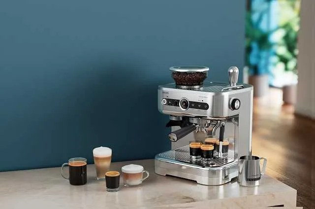 Semi Automatic espresso machine on table top with espresso beans and finished, fresh espresso