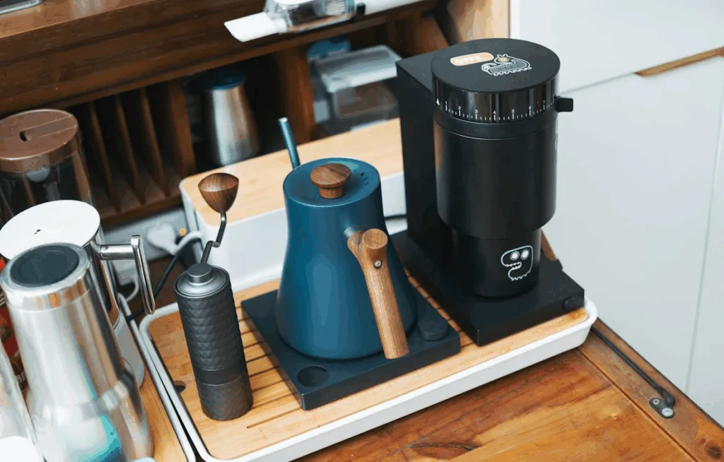 Different types of espresso machine accessories, including a grinder